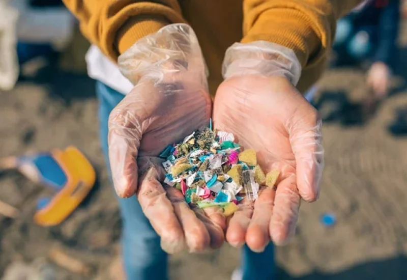 depositphotos_270743992-stock-photo-hands-with-microplastics-on-the